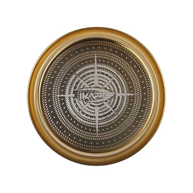 IKAPE Clockwork Sieb für hohe Extraktion in Gold von oben, lasergeschnittene Löcher in Ringen um ein Kompassstern-Muster
